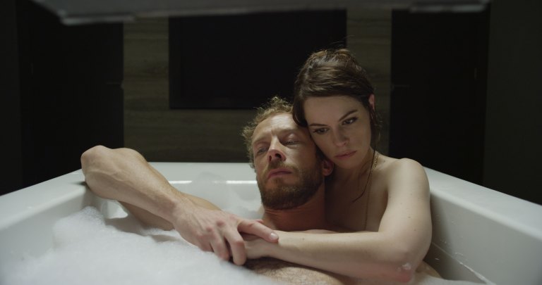 Alex (Kris Holden-Ried) and Kate (Emily Hampshire) .